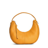 Sunshine | Crescent shaped shoulder bag with zipper closure and gold accents