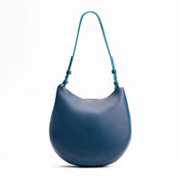 Caspian*Medium | Rounded shoulder bag with adjustable strap on a white background