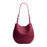 Orchid Medium | Rounded shoulder bag with adjustable strap on a white background