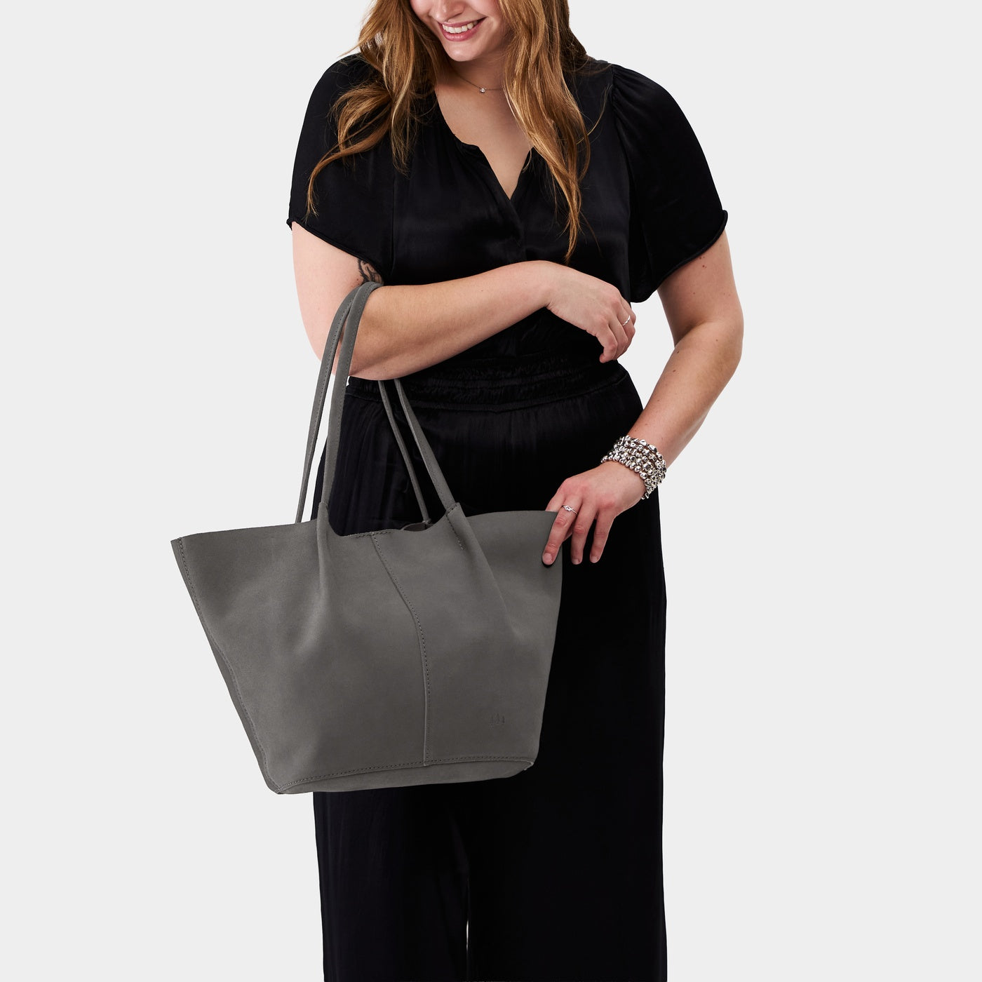 Smoke Grey*Oversized | Model holding extra wide bucket shaped tote bag with matching leather handles