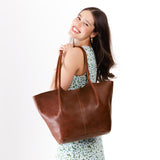 Nutmeg Oversized | Model holding a  leather tote bag 