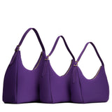 Imperial | Size comparison image of oversized, large, and medium u-shaped, flat-bottomed leather shoulder bags with adjustable strap