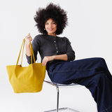 Hello Yellow Oversized | Model holding a  leather tote bag 