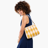 Sun Glaze Small | Triangular shoulder bag with antiqued brass finished hardware