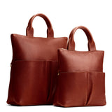 Nutmeg | A comparison image of a Large and Small Pembroke Crossbody Clutch