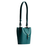 Harbor | Leather bucket shoulder bag with adjustable strap and magnetic closure on a white background