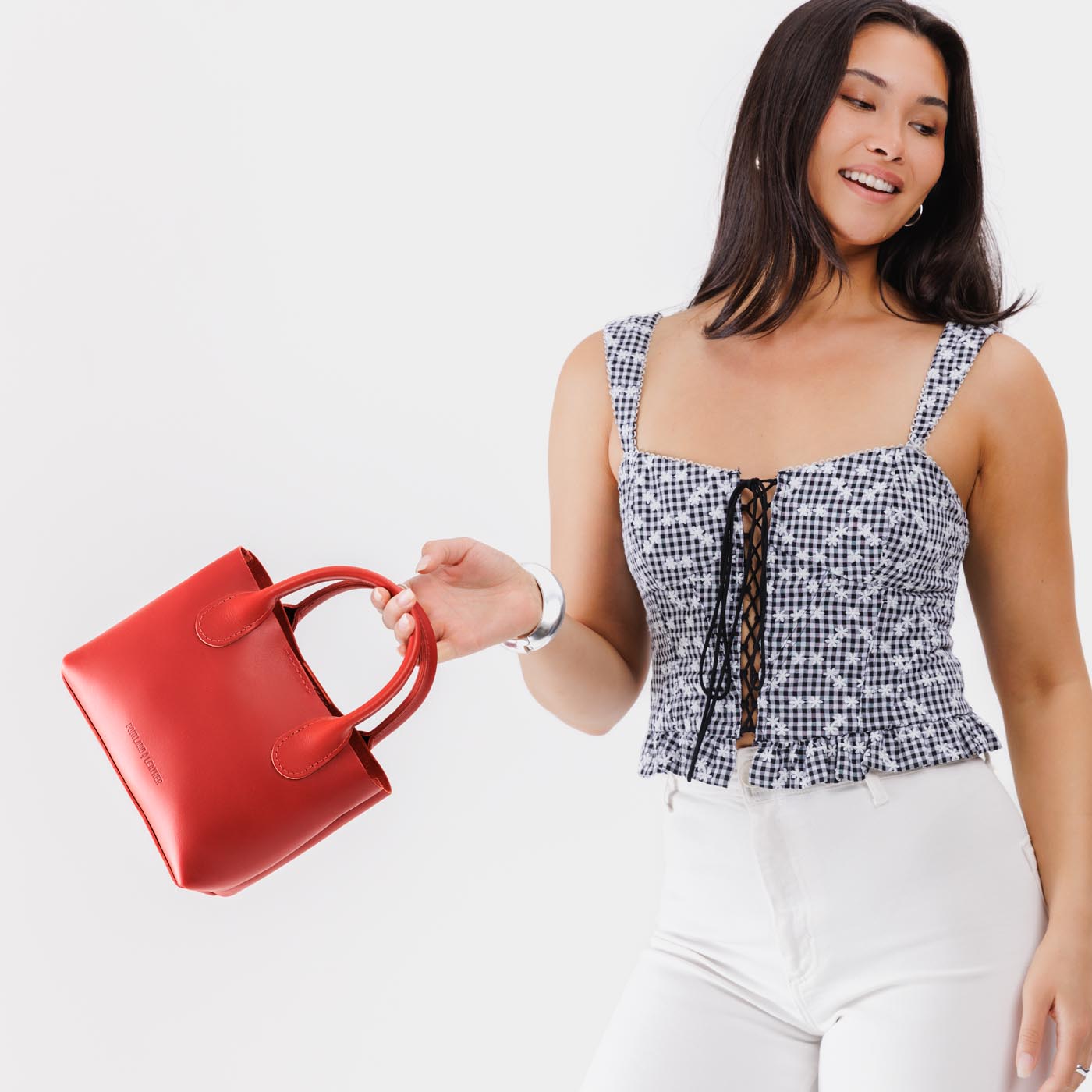 Ruby*Small | Model wearing petite tote purse with structured leather handles and crossbody strap