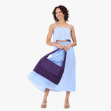 Imperial Large | A model holding a slouchy triangle shaped shoulder bag with a flap