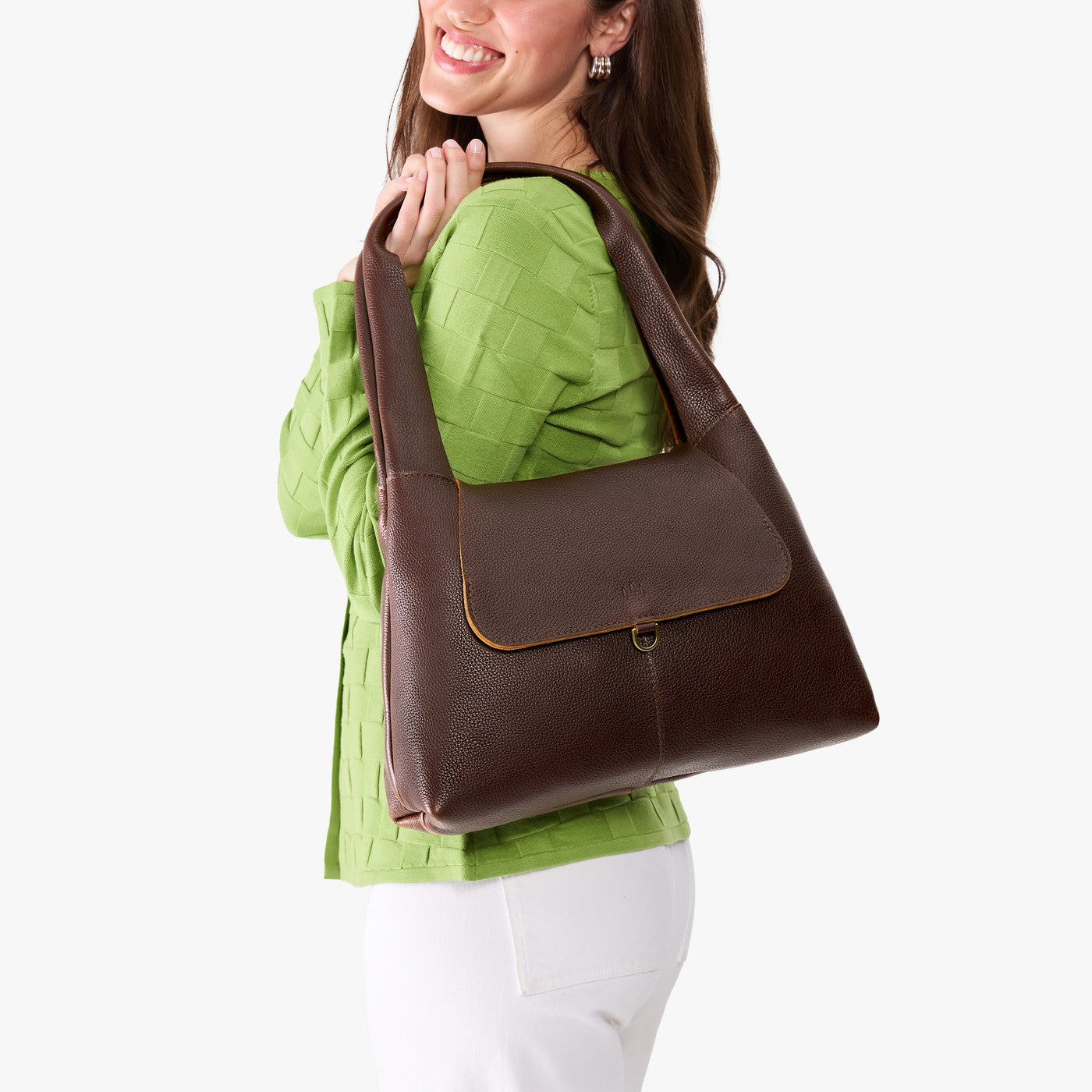 Coldbrew*Medium | A model holding a slouchy triangle shaped shoulder bag with a flap