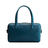 Westward Blue Large | Mini duffle shaped handbag with crossbody strap