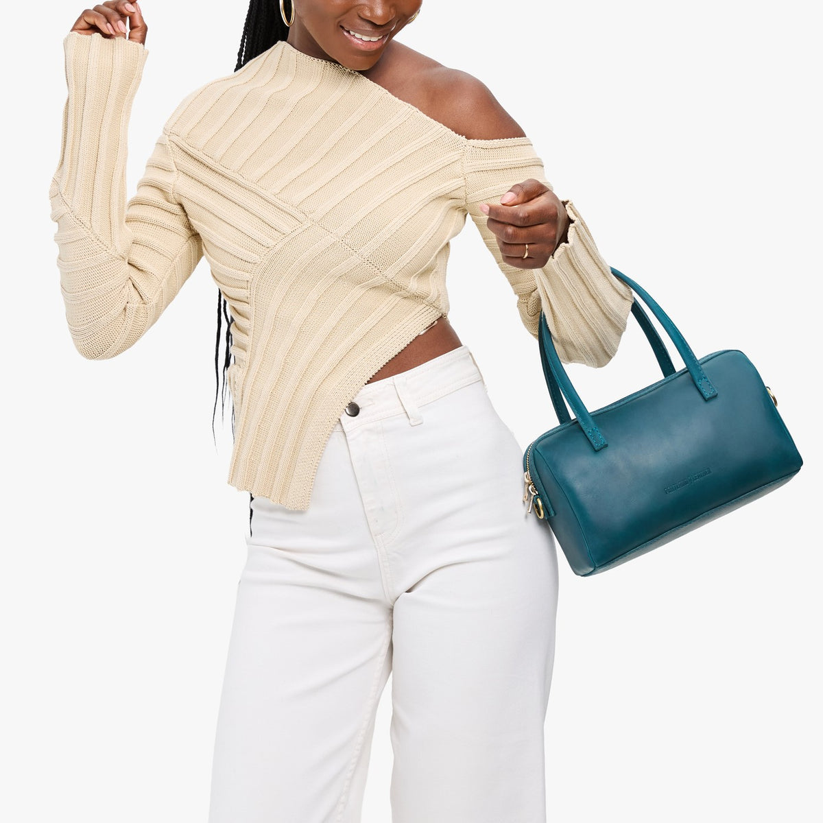 Westward Blue*Large | Model holding mini duffle shaped handbag with crossbody strap