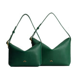 Sm/Lrg Slouchy Shoulder Bag Mystery | Slouchy leather shoulder bag with zipper opening and three metal tree emblems