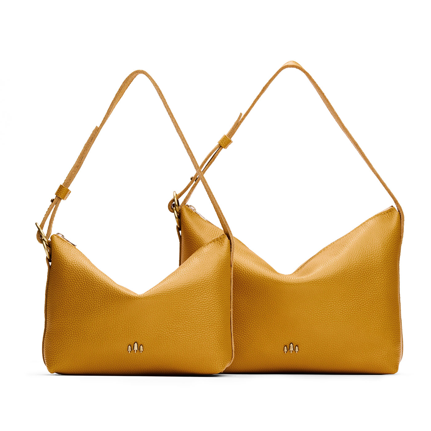 Sunshine | Size comparison shot of small and large slouchy shoulder bags with zipper opening and three metal tree emblems