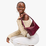Orchid Small | Petite slouchy leather shoulder bag with zipper opening and three metal tree emblems