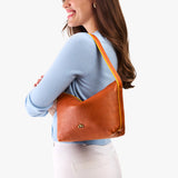 Sienna Small | Petite slouchy leather shoulder bag with zipper opening and three metal tree emblems