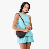 Moose Small | Model wearing petite half circle shaped sling bag