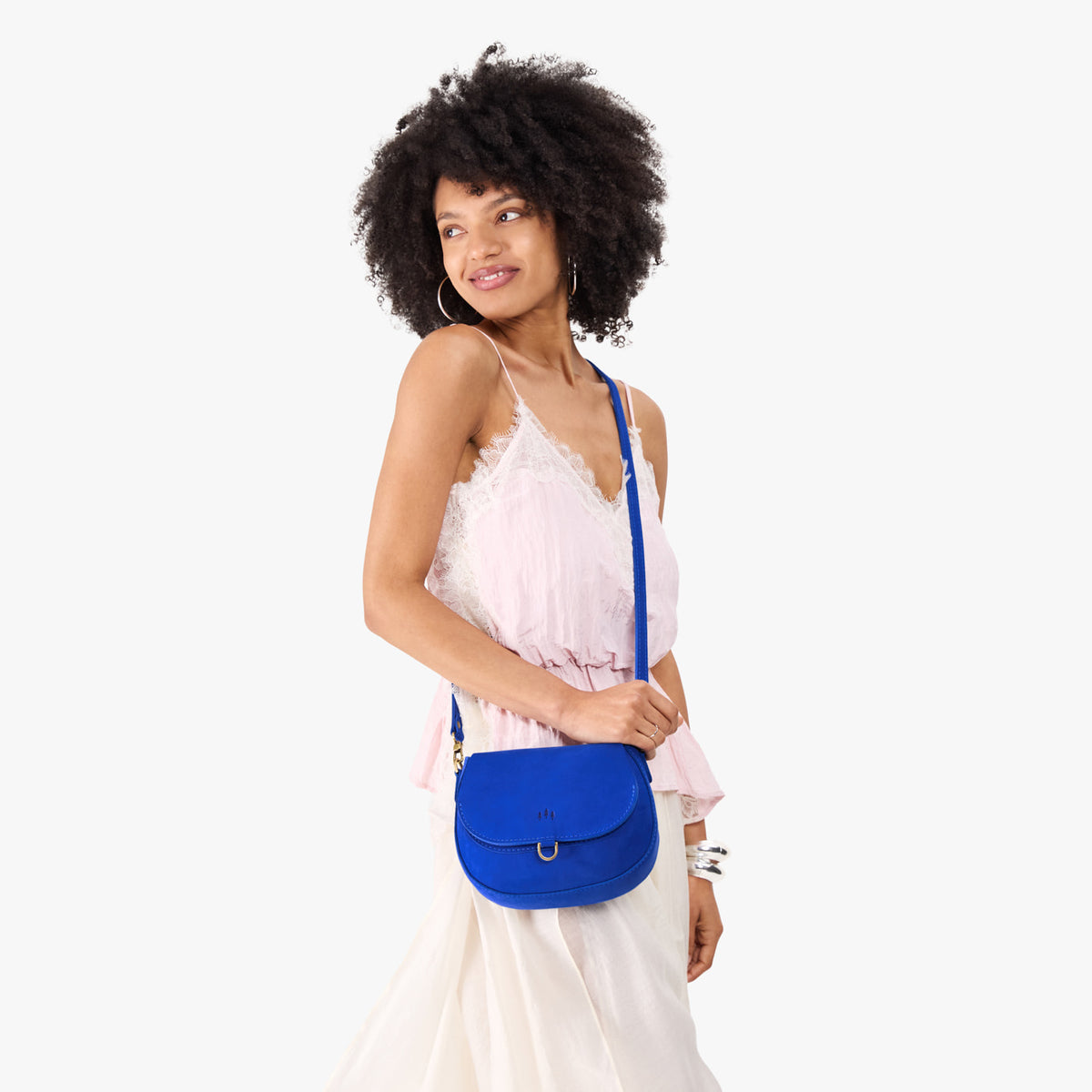 Blue Joy*Small | Model wearing a petite leather Crossbody with a flap and magnetic closure