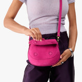 Royalty Small | Model wearing a leather Crossbody with a flap and magnetic closure
