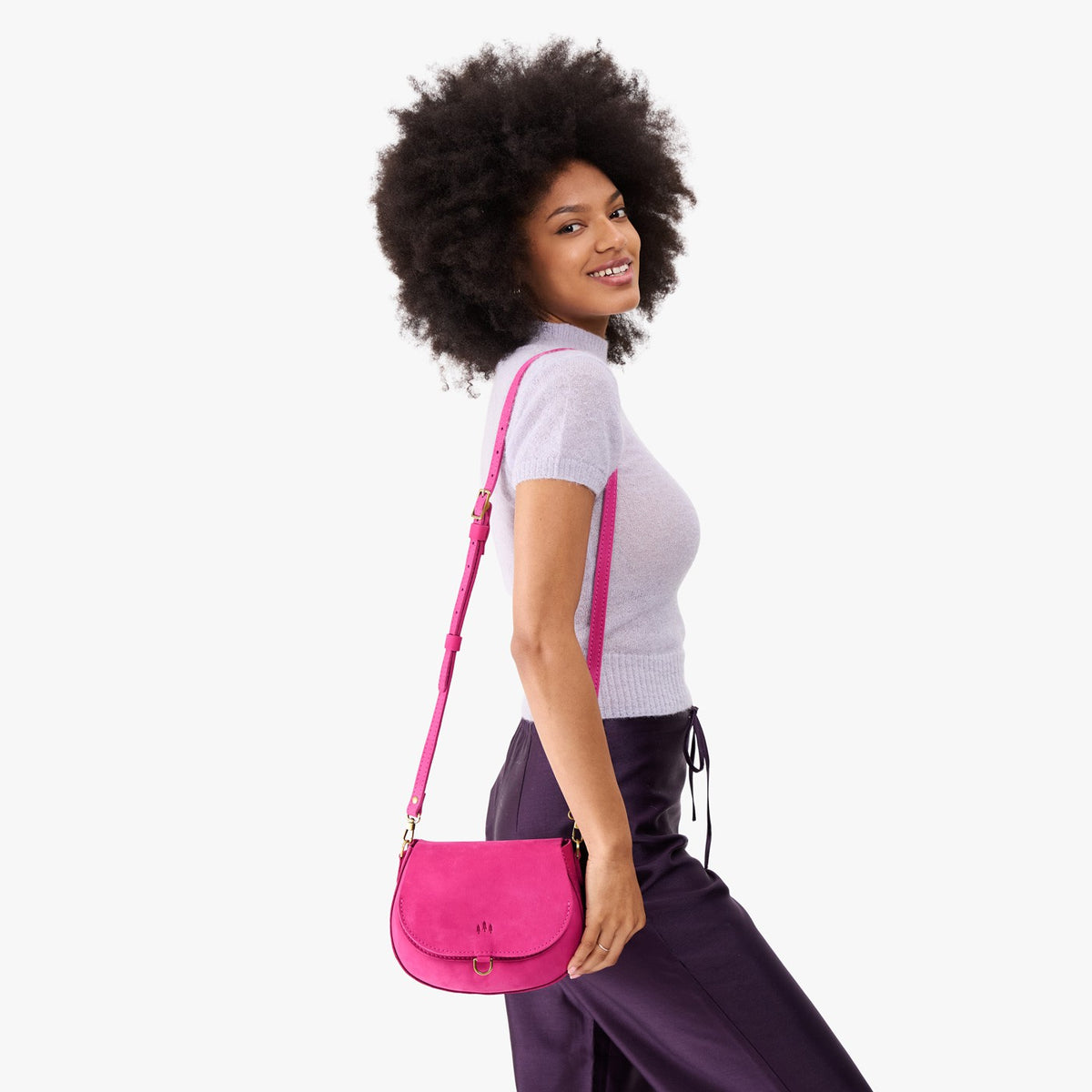 Royalty*Small | Model wearing a leather Crossbody with a flap and magnetic closure
