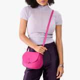 Royalty Small | Model wearing a leather Crossbody with a flap and magnetic closure