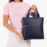 Cobalt Small | Model wearing a convertible tote clutch crossbody