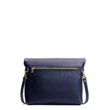 Cobalt Small | Convertible tote clutch crossbody with a back zipper pocket folded into a clutch