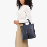 Night Owl Small | Model wearing a convertible tote clutch crossbody