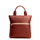 Nutmeg Small | Convertible tote clutch crossbody with a front zipper pocket and top carry handles