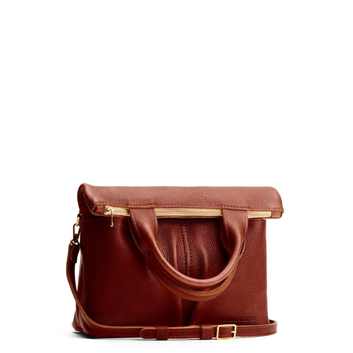 Nutmeg*Small | Convertible tote clutch crossbody with two large front pocket and top carry handles folded into a clutch