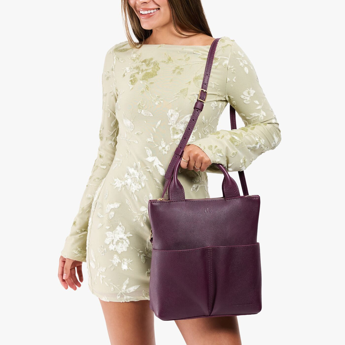 Plum*Small | Model wearing a convertible tote clutch crossbody