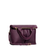 Plum Small | Convertible tote clutch crossbody with two large front pocket and top carry handles folded into a clutch