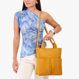 Sunshine Small | Model wearing a convertible tote clutch crossbody