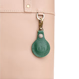 Bacalar | Round leather AirTag holder with snap closure and swivel lobster claw clasp