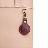 Cognac | Round leather AirTag holder with snap closure and swivel lobster claw clasp