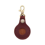 Cognac | Round leather AirTag holder with snap closure and swivel lobster claw clasp