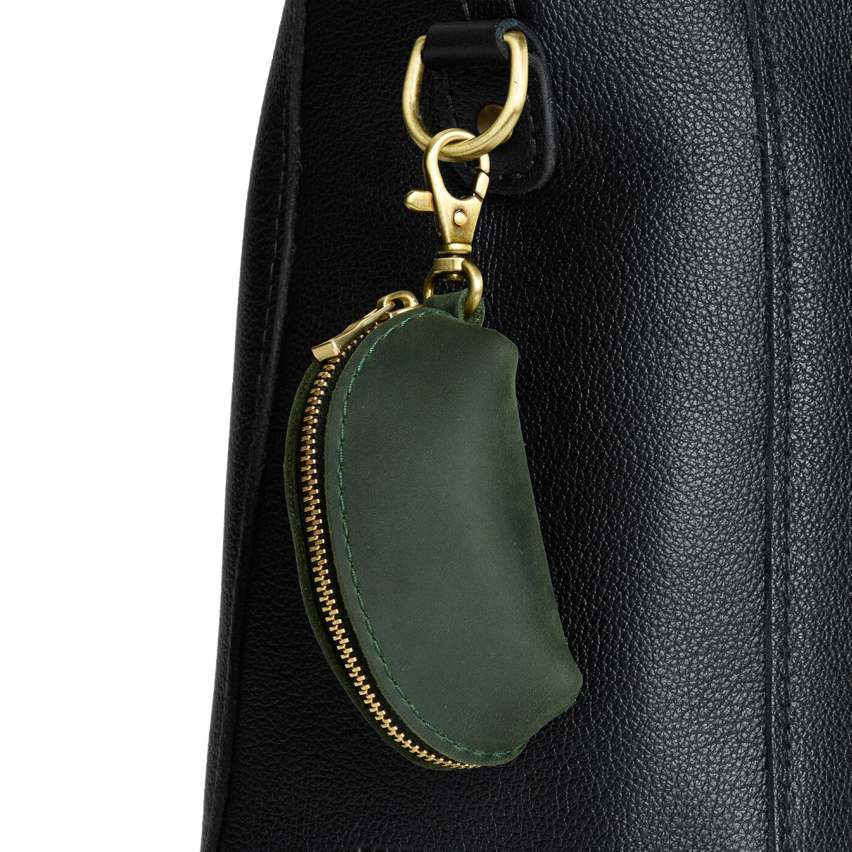 Evergreen | Taco shaped leather pouch with zipper and swivel lobster clasp on white background