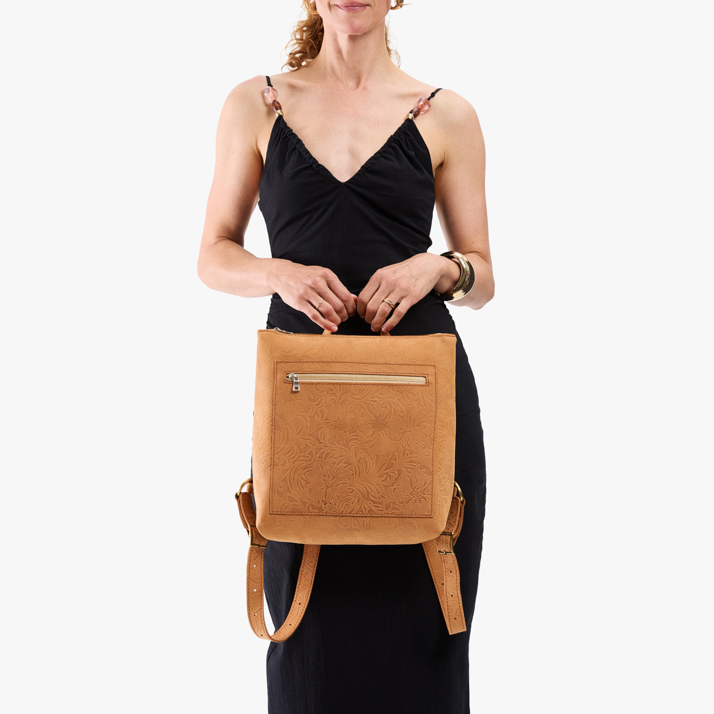 Desert Flower | Model wearing square slim leather tote backpack