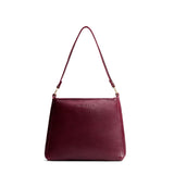 Cabernet Small | Large triangular shoulder bag with antiqued brass finished hardware