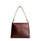 Cognac Small | Triangular shoulder bag with antiqued brass finished hardware