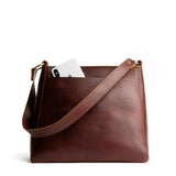 Cognac Small | Triangular shoulder bag with antiqued brass finished hardware