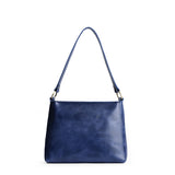 Cowboy Blue Small | Triangular shoulder bag with antiqued brass finished hardware