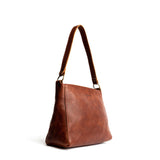 Nutmeg Classic | Triangular shoulder bag with antiqued brass finished hardware