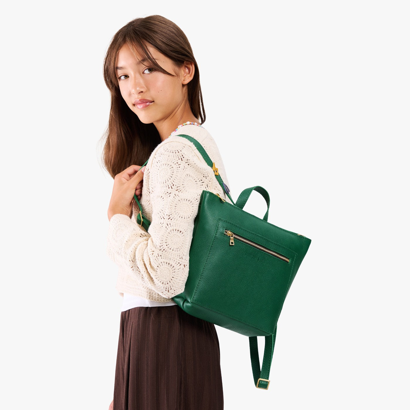 Bacalar | Model wearing a petite square slim leather tote backpack with zipper closure and adjustable straps