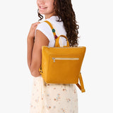 Sunshine | Model wearing a petite square slim leather tote backpack with zipper closure and adjustable straps