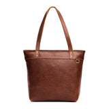 Nutmeg Medium Zipper | Model wearing leather tote bag with riveted straps and exterior key loop