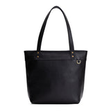 Pebbled--black Medium Zipper | Model wearing leather tote bag with riveted straps and exterior key loop