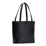 Pebbled--black Medium Zipper | Model wearing leather tote bag with riveted straps and exterior key loop